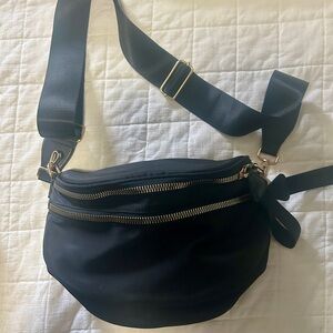 Elegant Black Crossbody Bag with Gold Accents